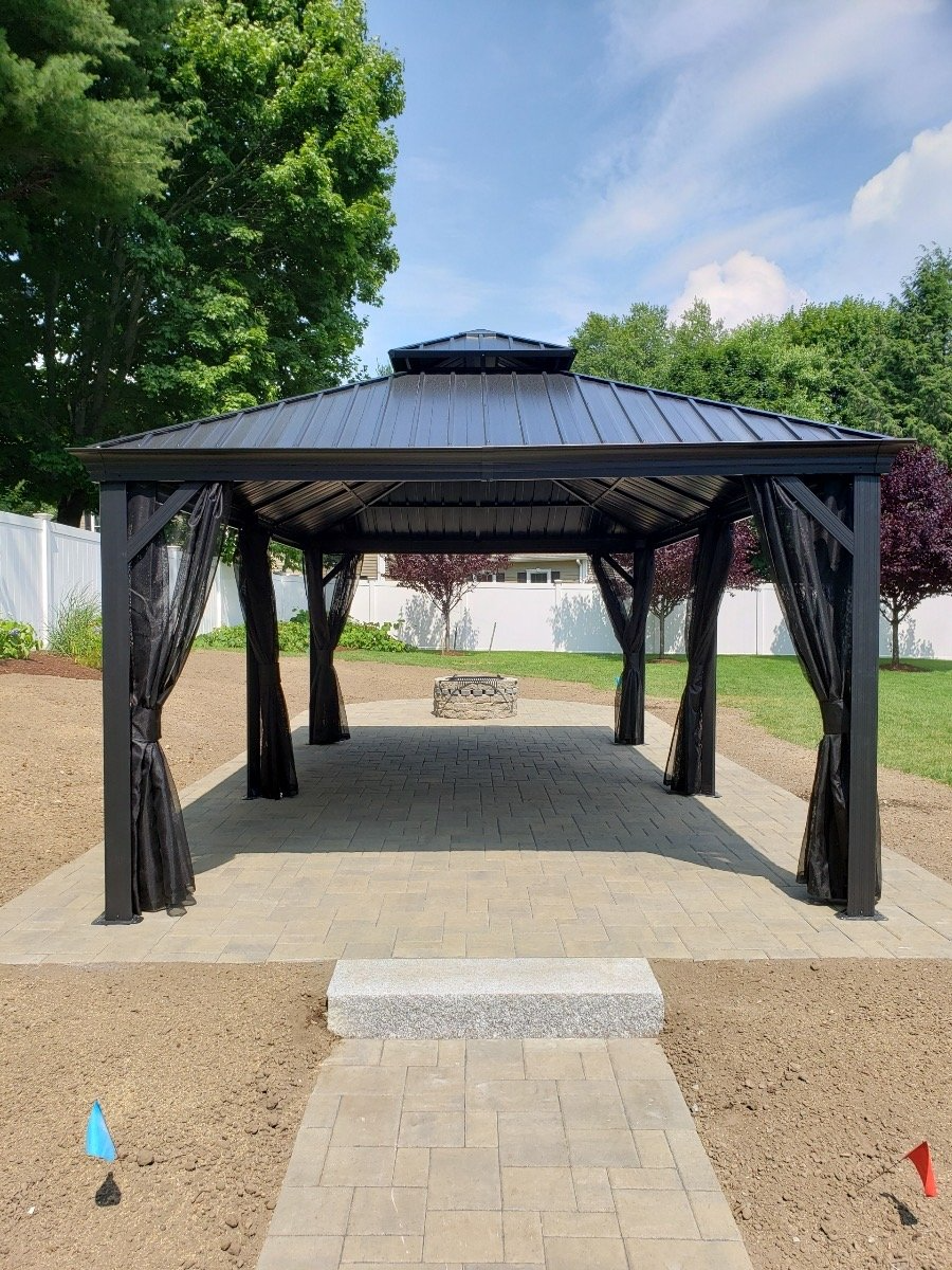 Patio and firepit installation. Hardscape design, gazebo, and patio project in Lexington, MA. 