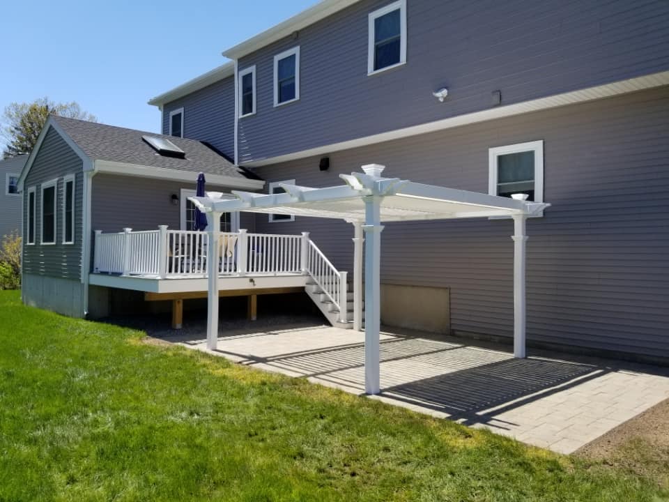 Hardscaping project installation in Burlington, MA. Gazebo and patio install coming off of the new deck.