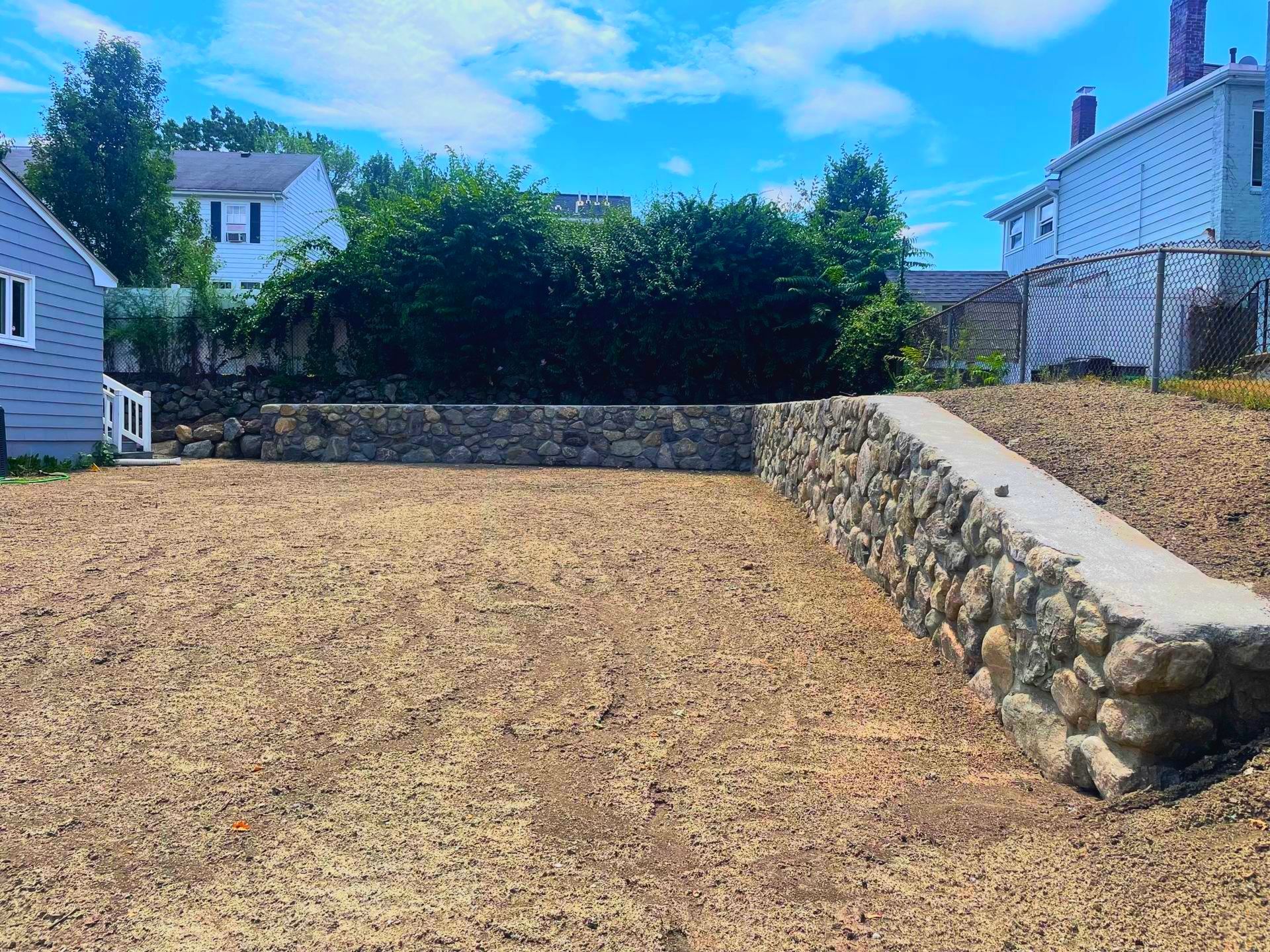  Stone wall design contractors in Arlington, MA. Excavation and grading project. 