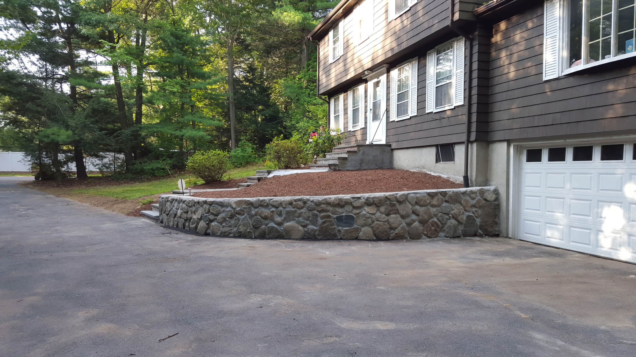 Stone wall project. New England Fieldstone retaining wall  in Bedford, Lexington, Burlington, and Arlington, MA.