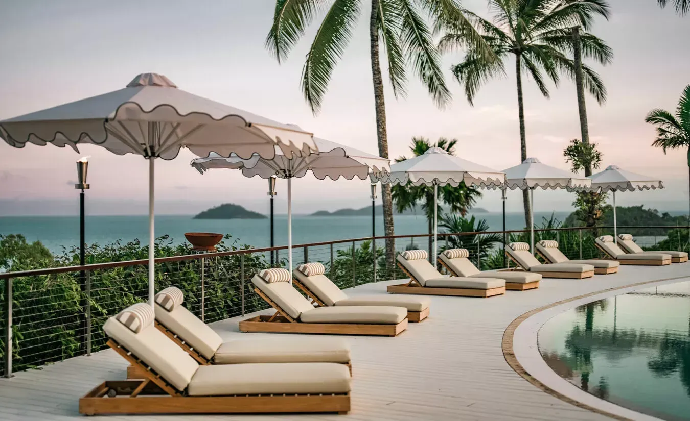 Pool lounges with a view at The Elandra Mission Beach