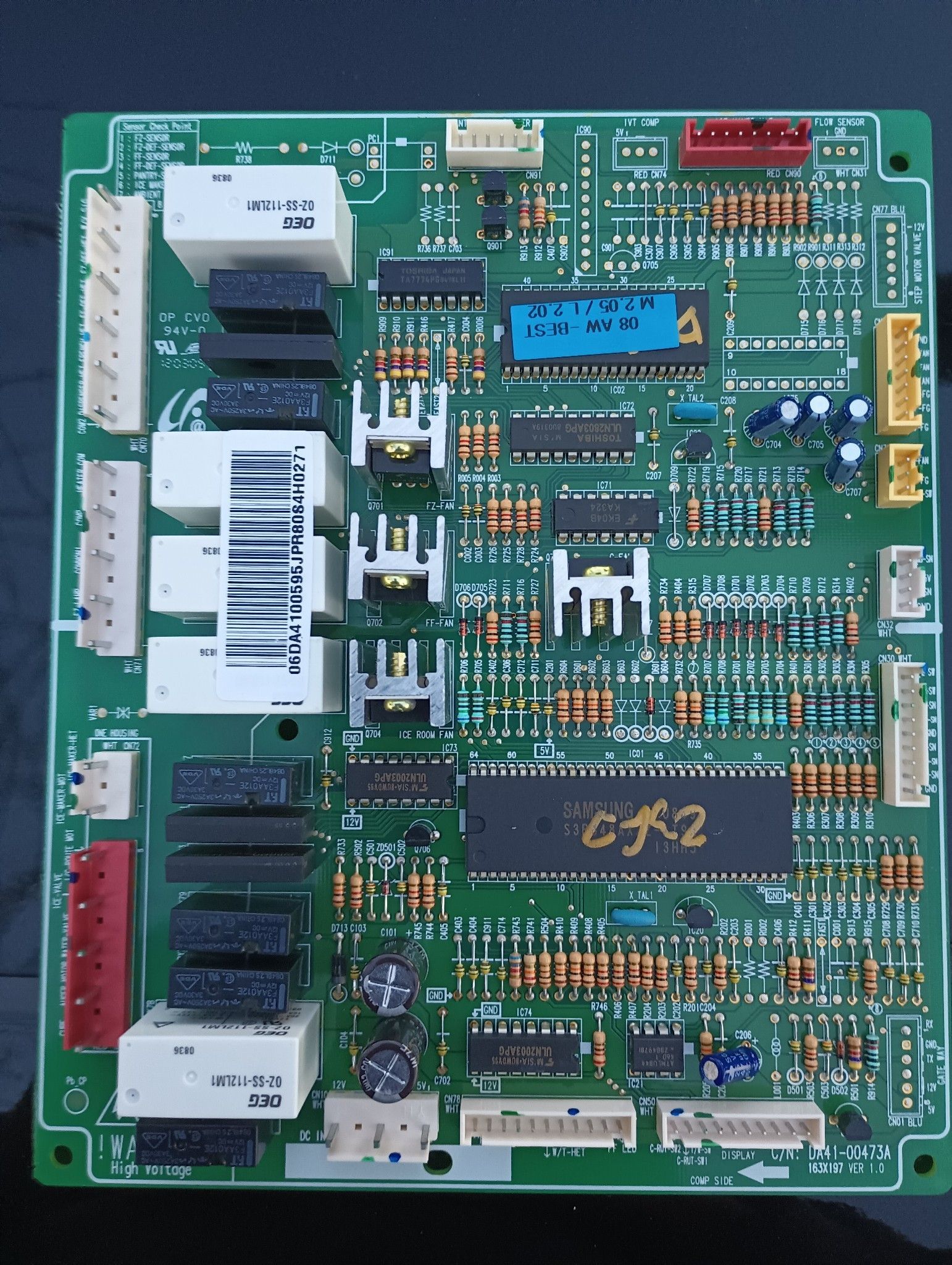 A green motherboard with a chip that says cf2 on it