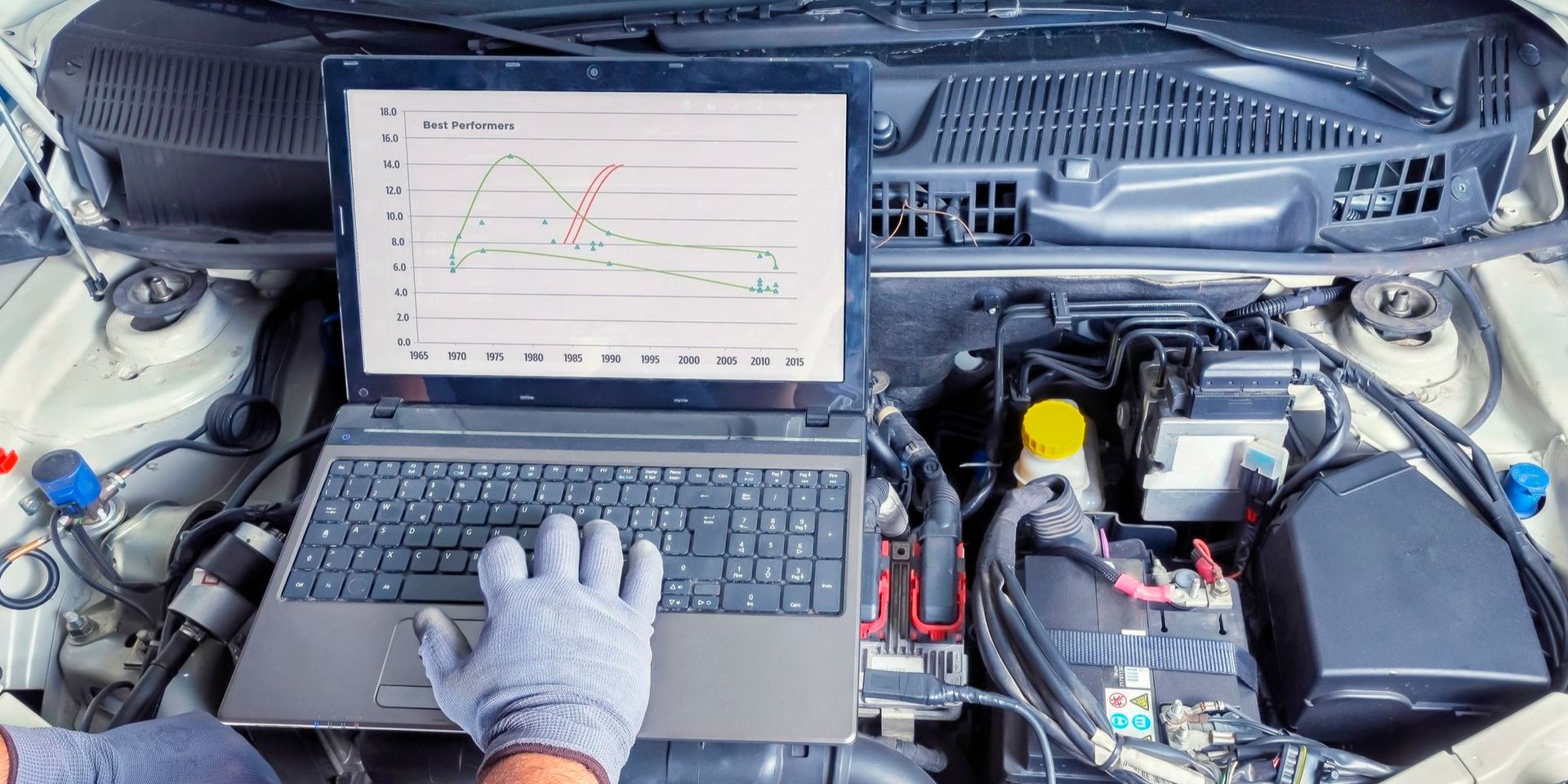 A person is carrying out an engine diagnostic hood of a car.