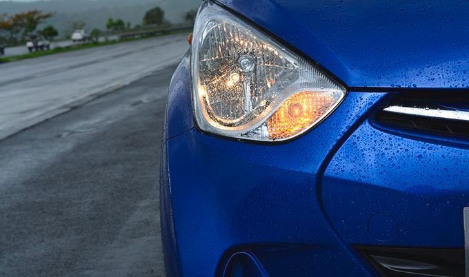 close up of blue car protected by auto insurance