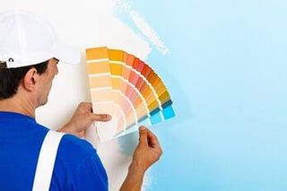Painter choosing color from palette — Interior Painting in Salem, OR