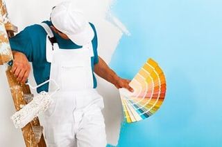 Man choosing color from palette — Interior Painting in Salem, OR
