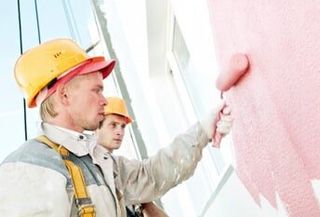 Worker painting wall — Exterior Painting in Salem, OR