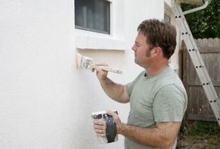Man painting wall — Exterior Painting in Salem, OR