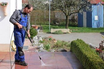 Man pressure washing tiled floor — Pressure Washing in Salem, OR