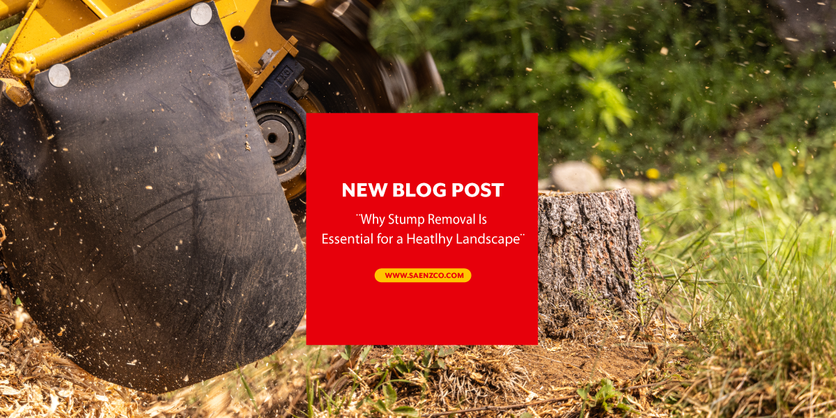 A machine is cutting a tree stump in the grass.