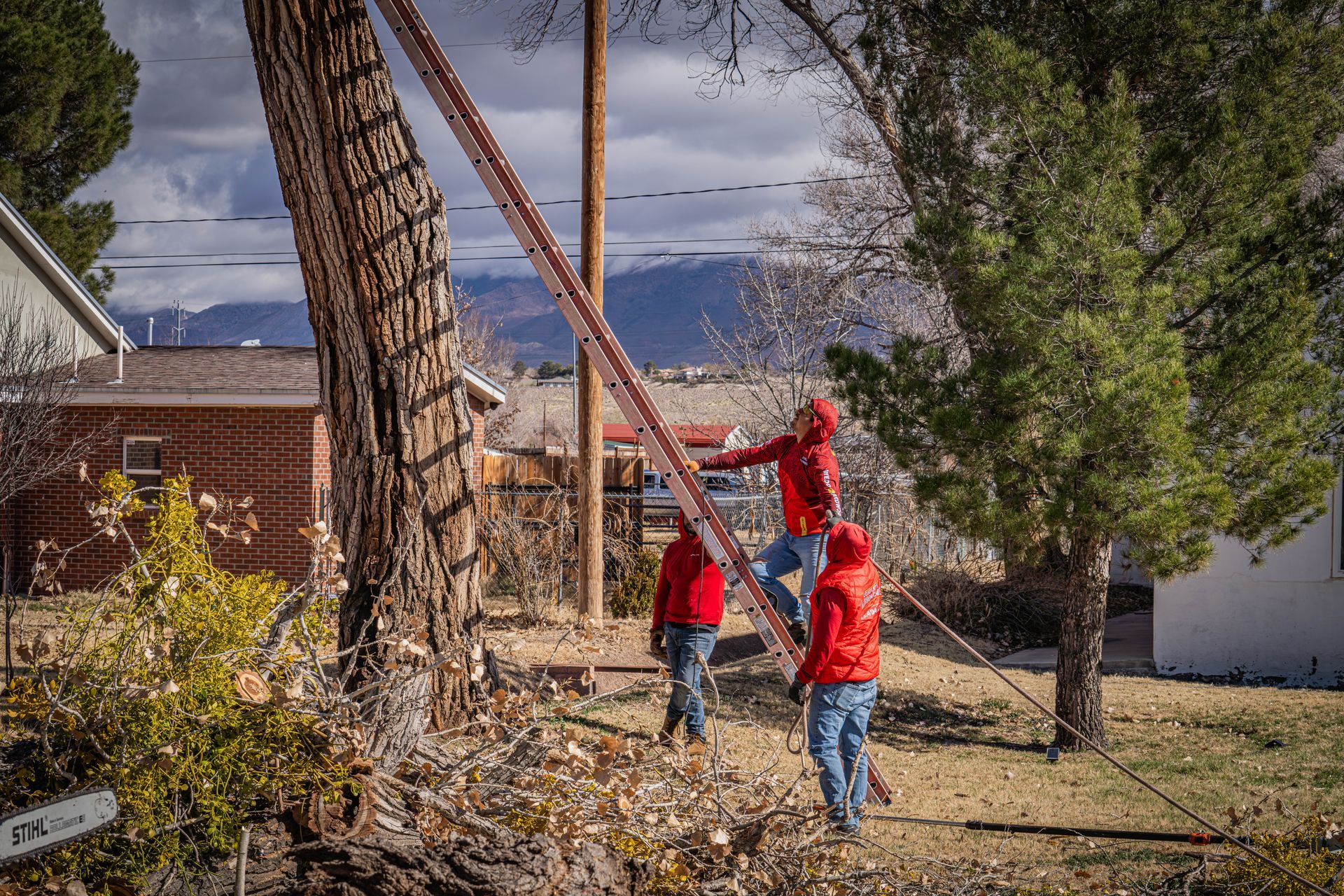 A red and yellow truck is parked on the side of the road.