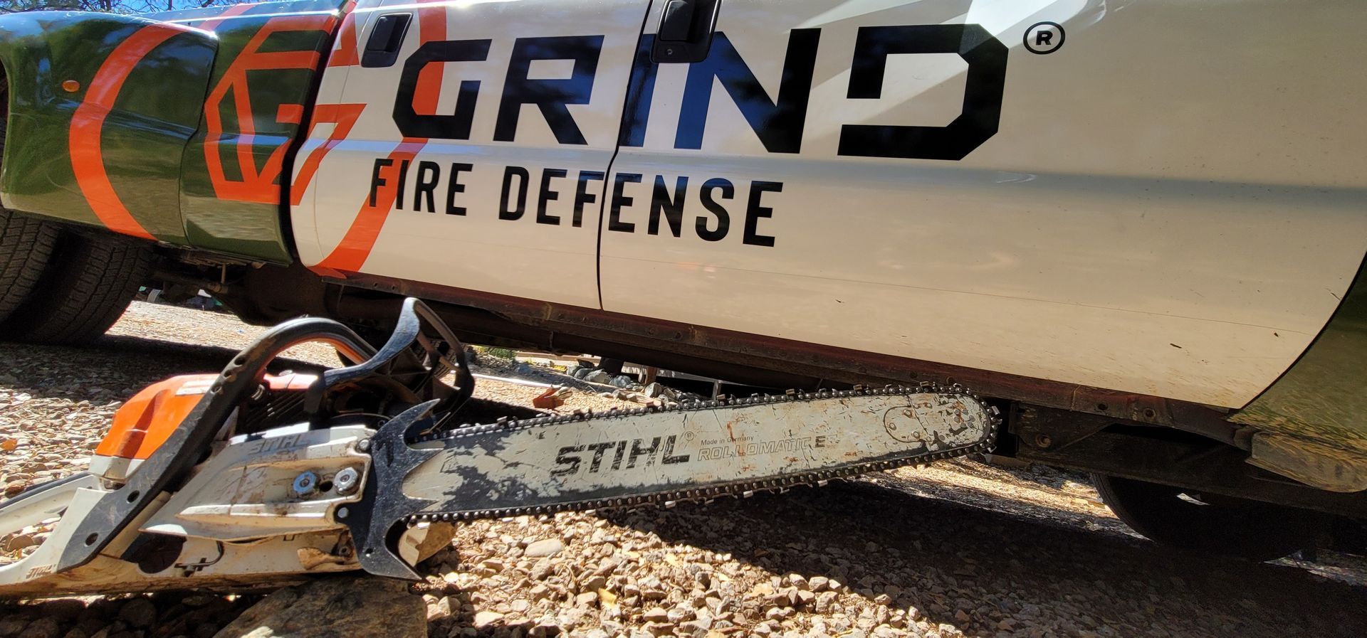 Grind Fire Defense truck and chainsaw for tree removal