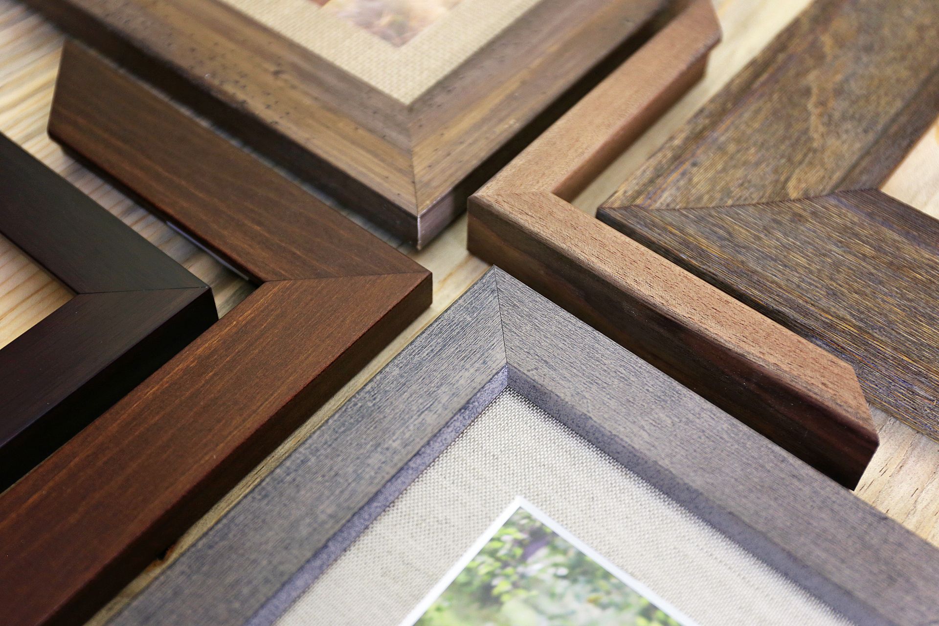 Close-up of high-quality hardwood corner samples for handcrafted custom photo frames. Close-up of high-quality hardwood corner samples for handcrafted custom photo frames.