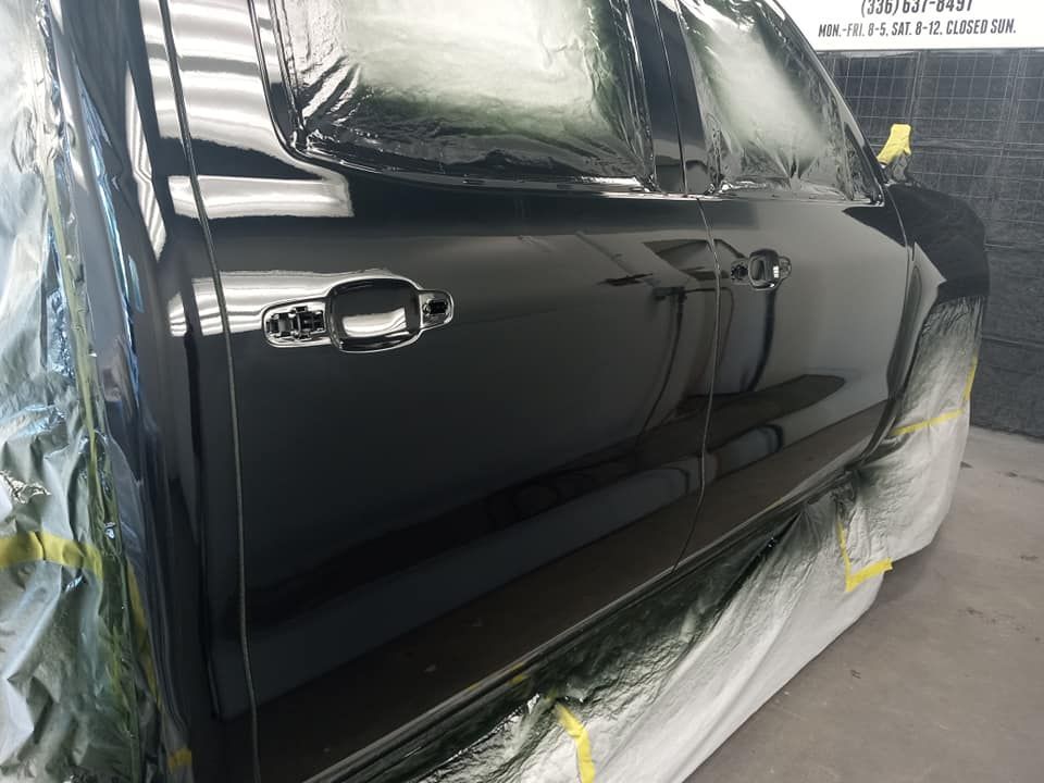 Black Auto Paint On Side — Reidsville, NC — Ferguson Paint & Body Towing & Recovering Inc.