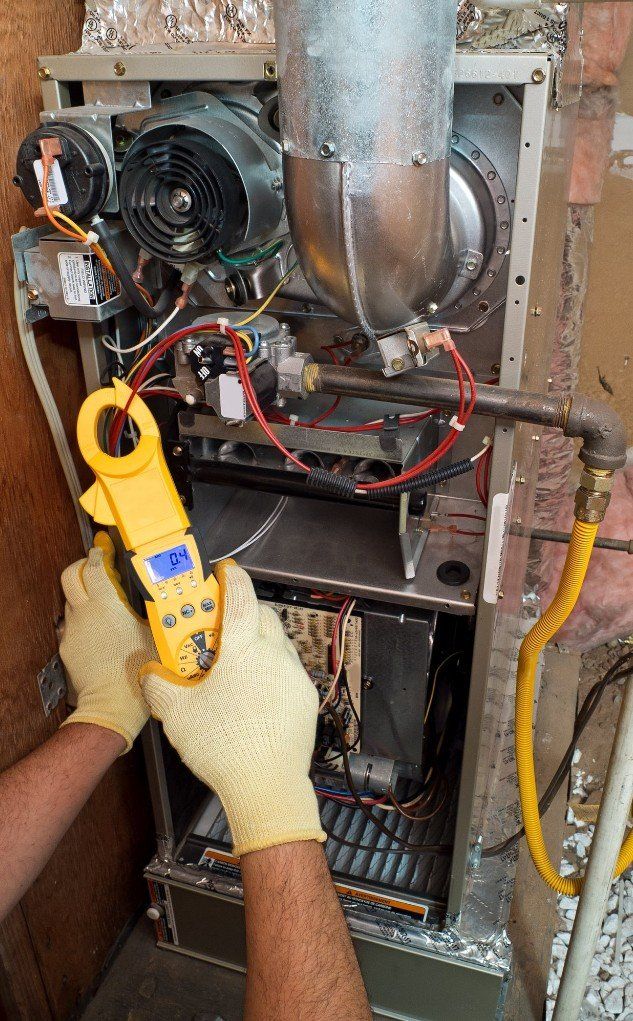 HVAC Technician Using Gauge to Inspect Wiring, Springfield VA