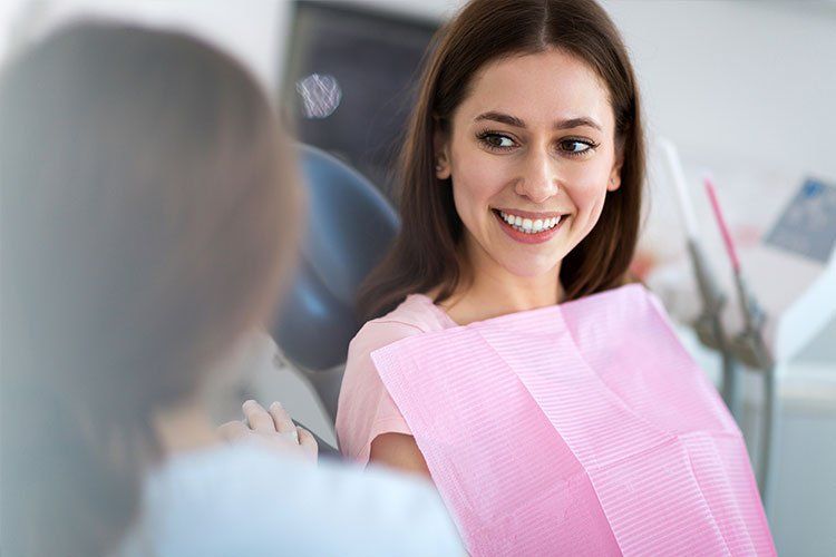 Lady Smiling To the Dentist