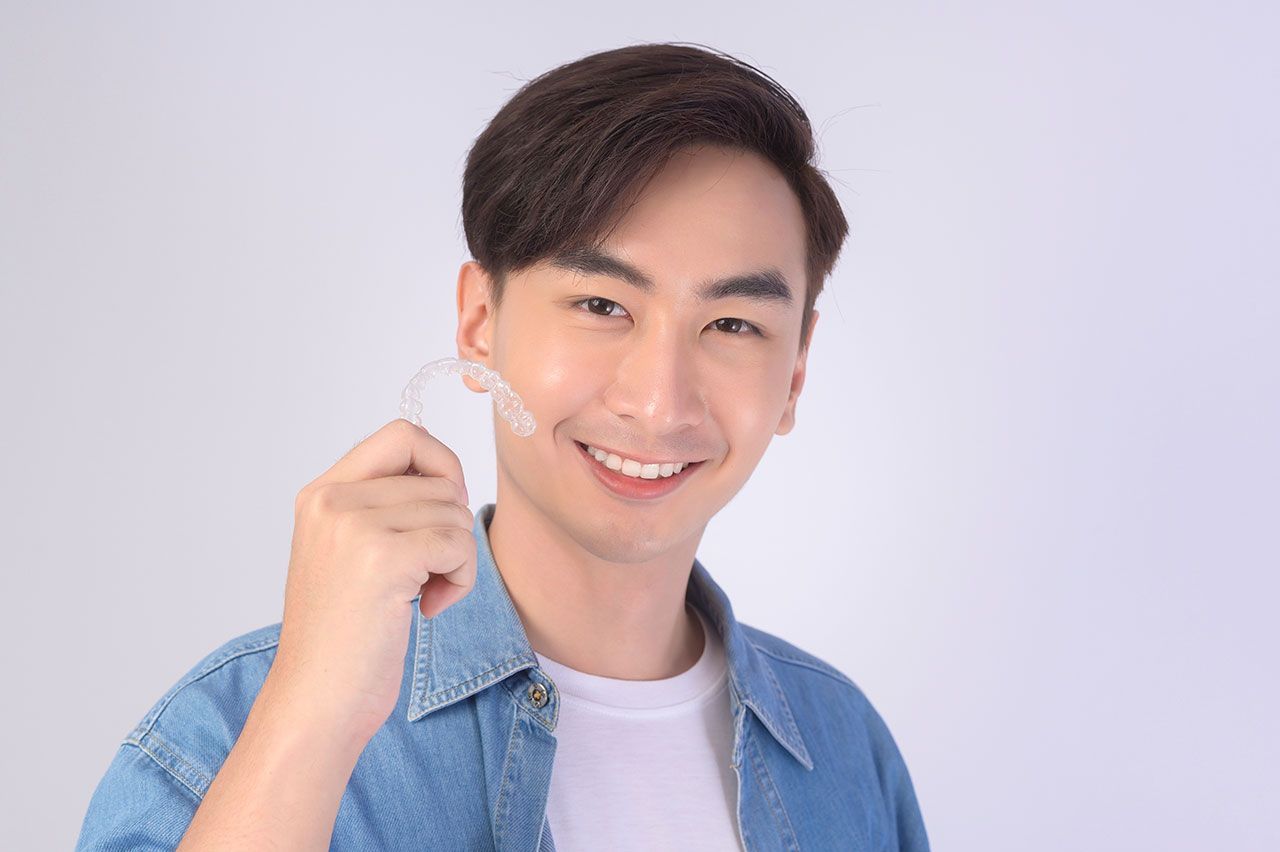 Invisalign vs. Veneers