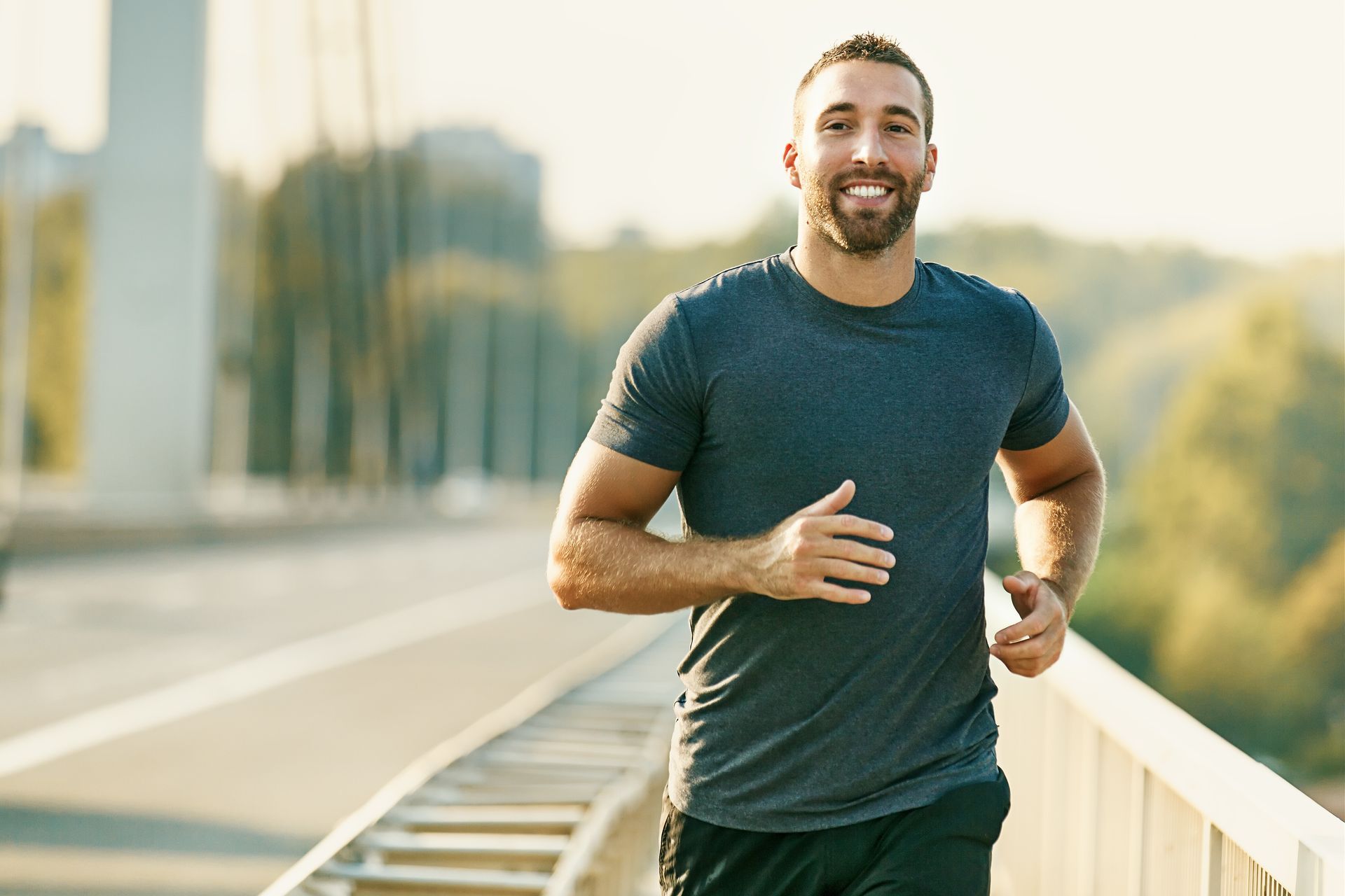 a smiling man is jogging
