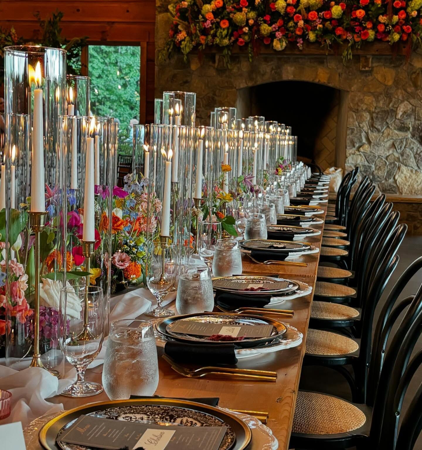 wedding reception table with tall candles