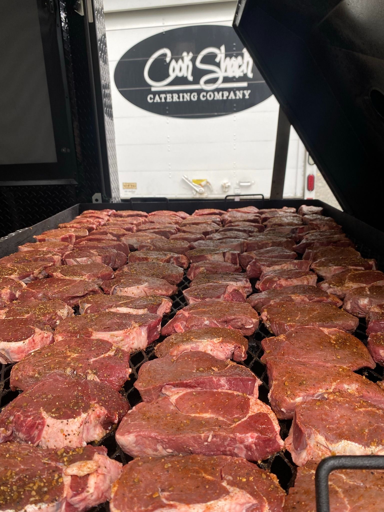 ribeye steaks on grill