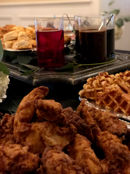 chicken and waffles with assorted syrups