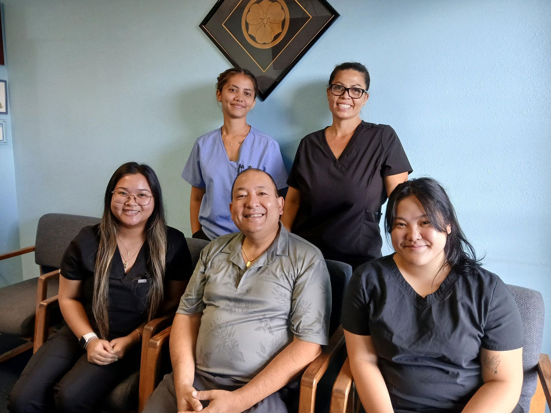 A group of people are posing for a picture.