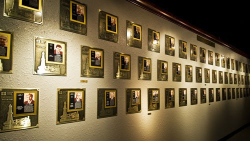 a wall with a lot of plaques on it