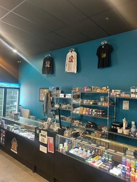 The inside of a store with blue walls and shelves