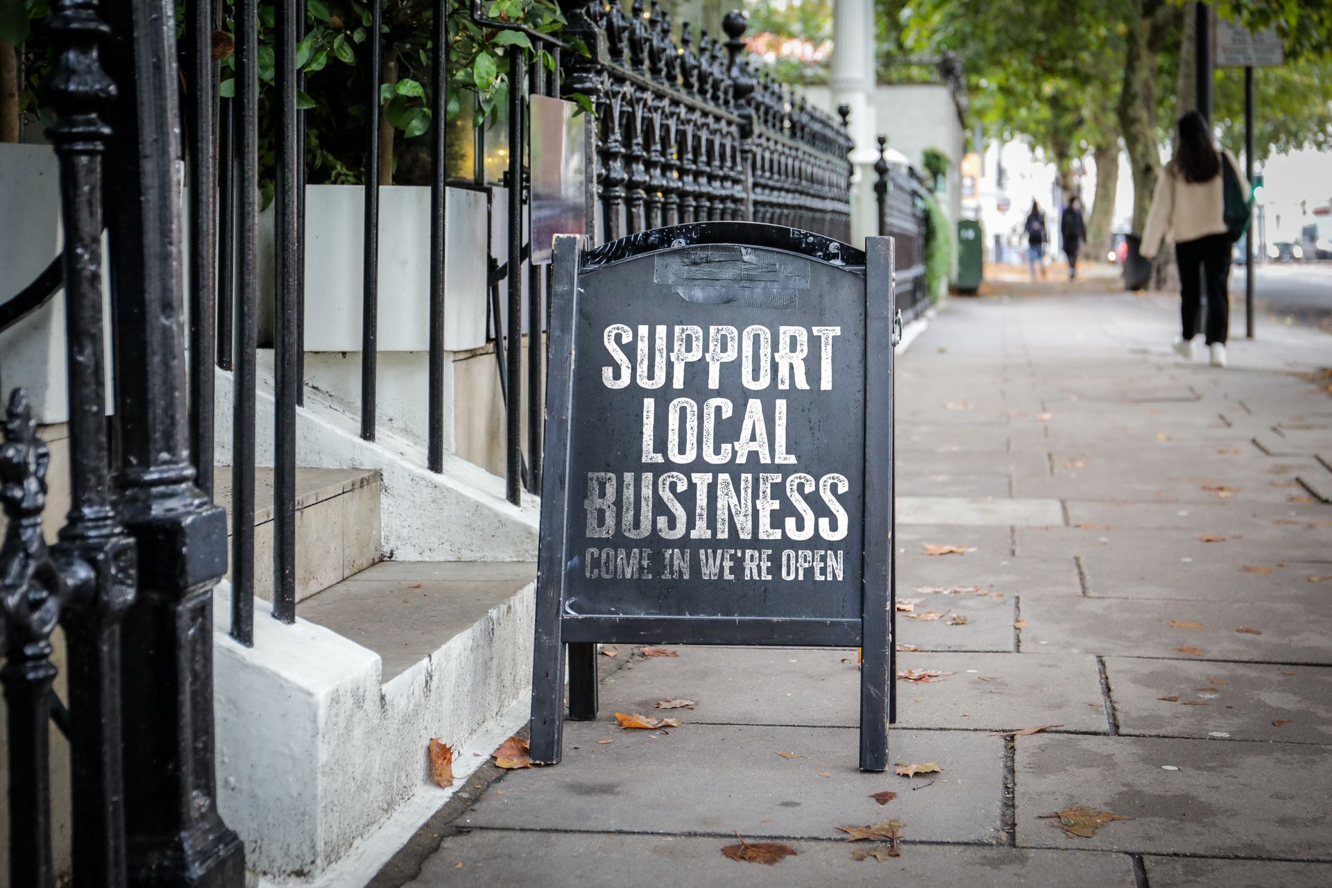 Custom business Sign on sidewalk