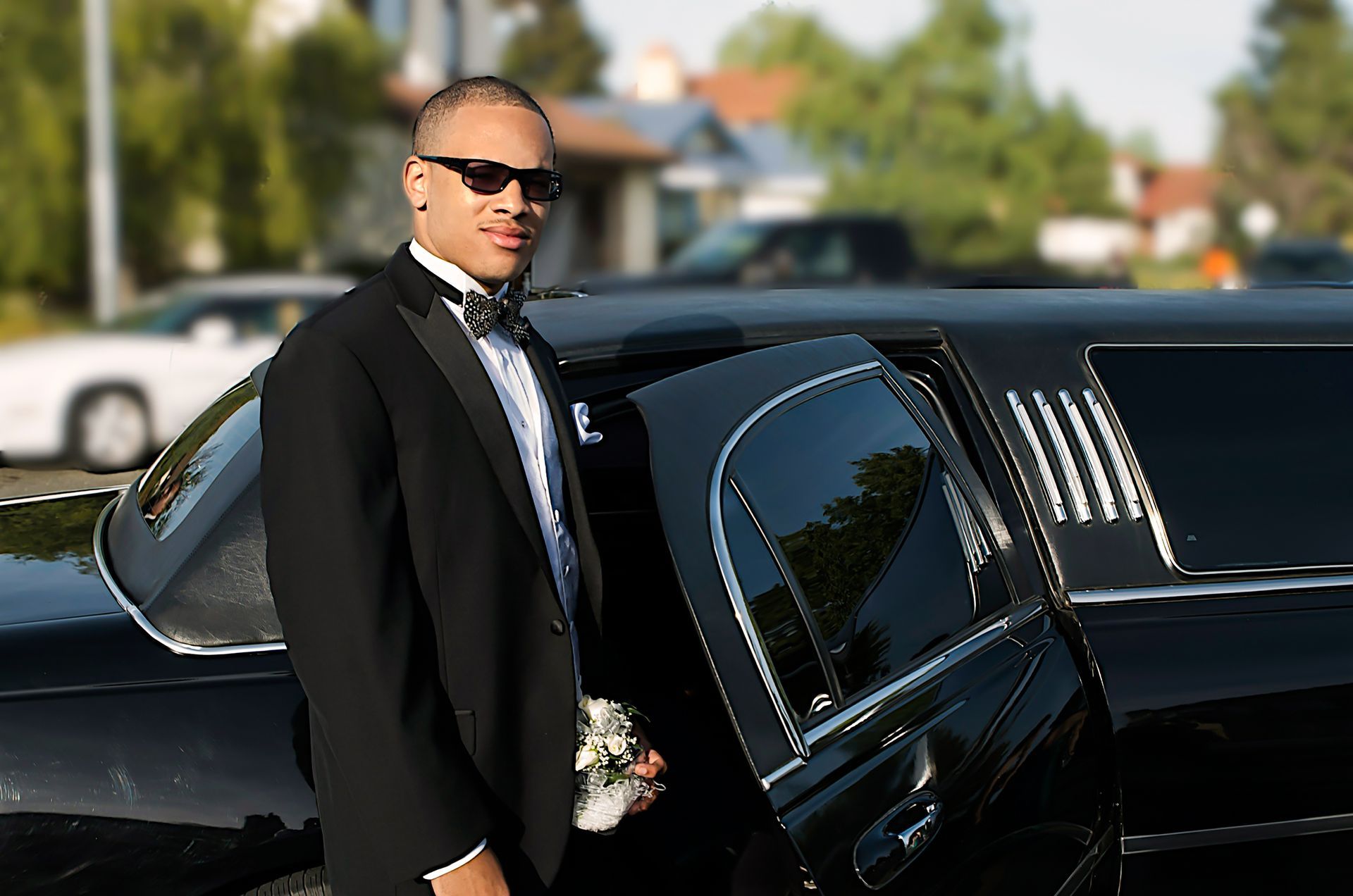 groom beside the limo