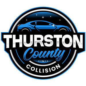 Thurston County Collision logo: blue car silhouette, white text on a black and blue circular emblem.
