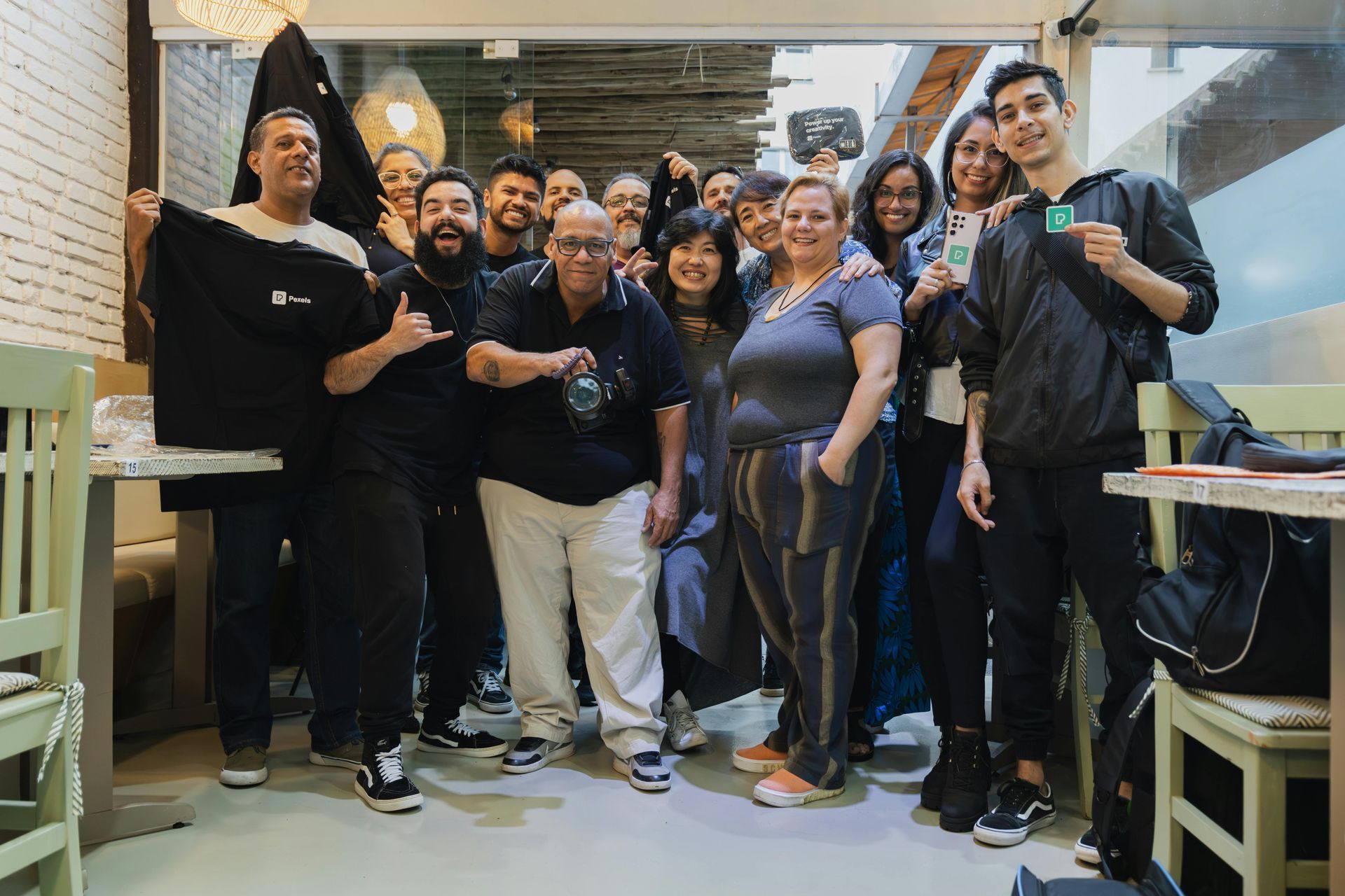 A group of people are posing for a picture in a restaurant.