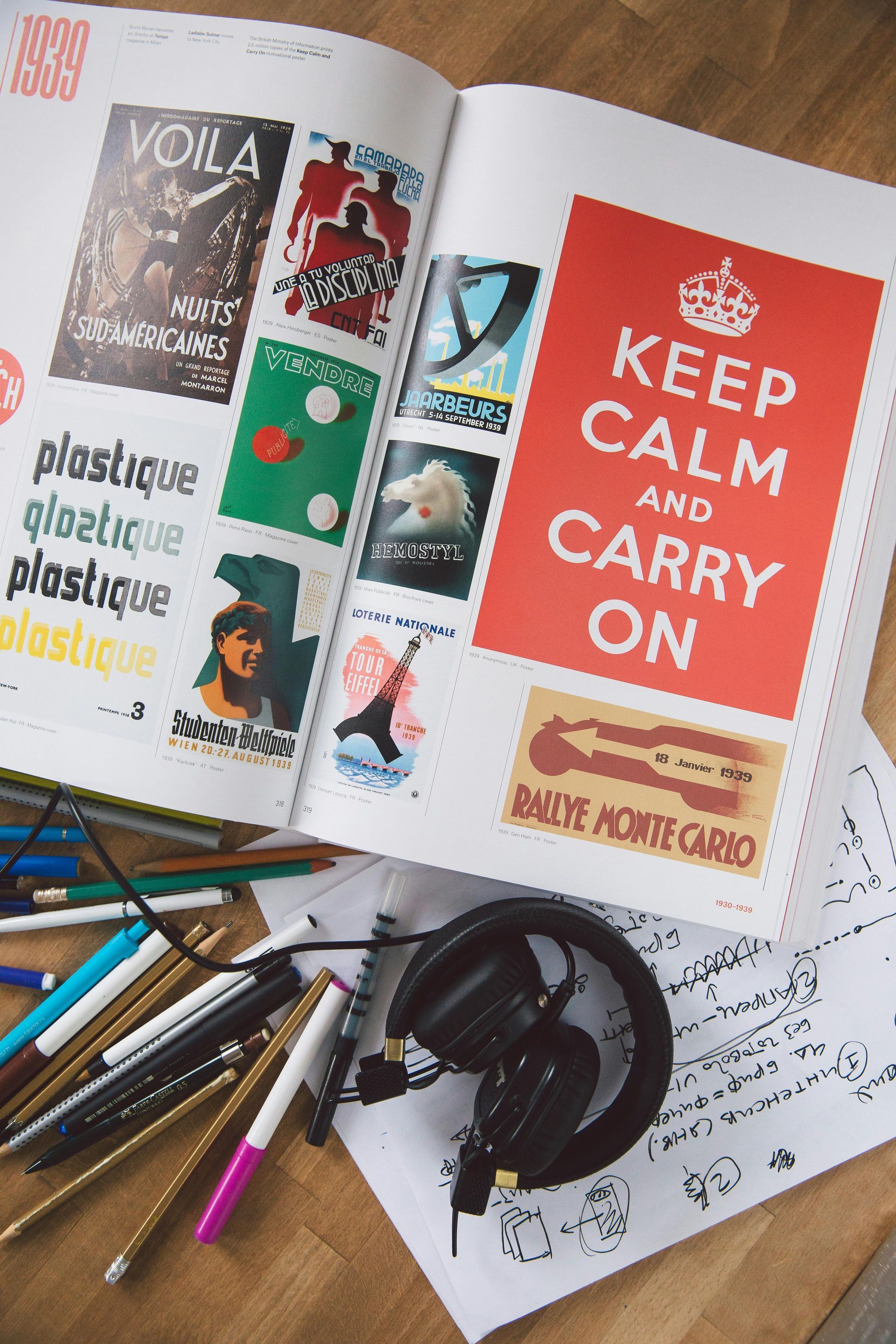 A book is open to a page that says keep calm and carry on