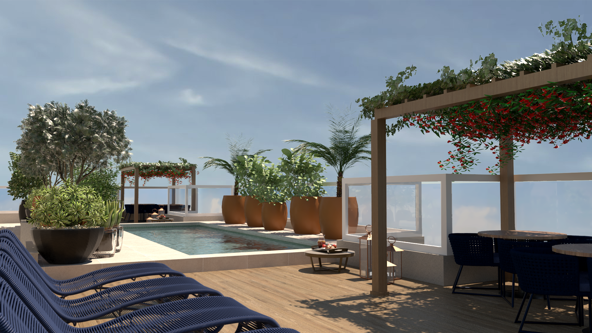 Terraço na cobertura com piscina, espreguiçadeiras, área para refeições e vasos de plantas sob um céu ensolarado.