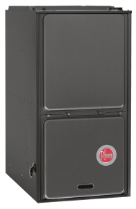 A rheem air conditioner is sitting on top of a white surface.