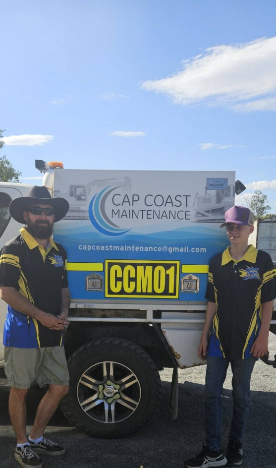 Two men stand beside a Cap Coast Maintenance truck. One wears a hat and shorts, the other a purple cap and jeans— Cap Coast Maintenance In Alton Downs, QLD