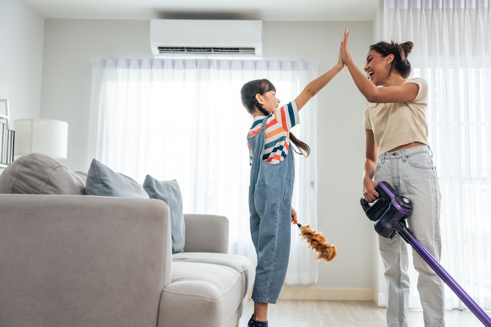 Woman at desk gestures toward man standing, in office setting.