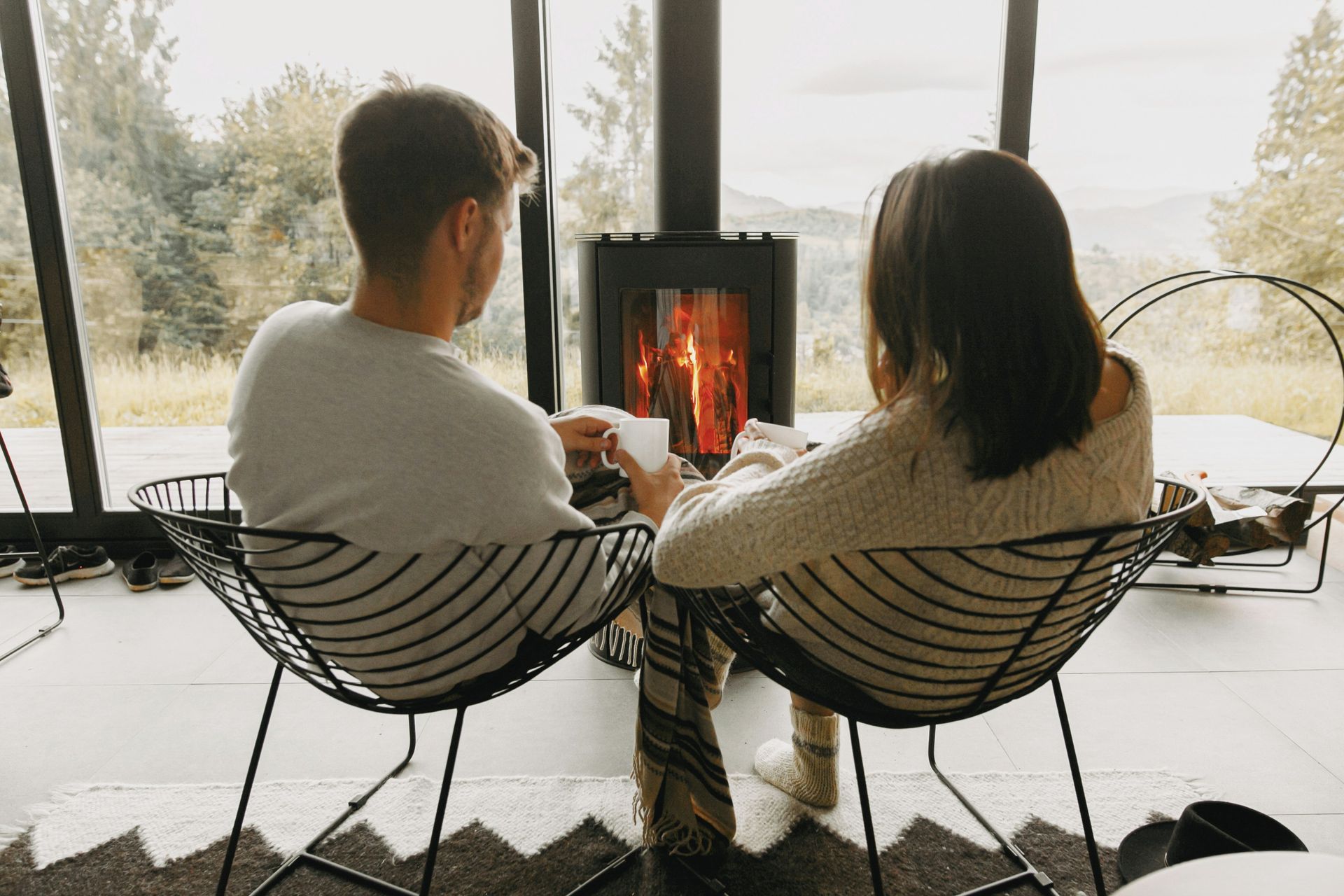 Mechanic working on the engine of a truck outdoors.