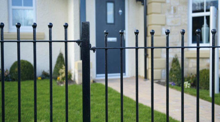 Black metal storm-ready fence protecting a Fargo home