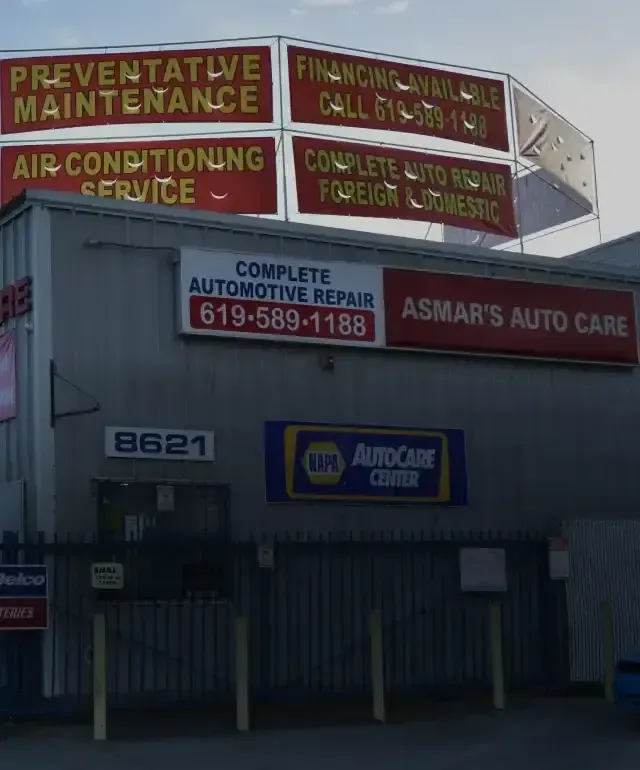 Outside of our shop with signs in Spring Valley, CA | Asmar's Auto Care