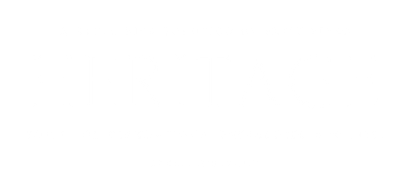 A modern bedroom featuring a light wood bed frame, striped pillows, white walls, and a large window with soft sunlight.