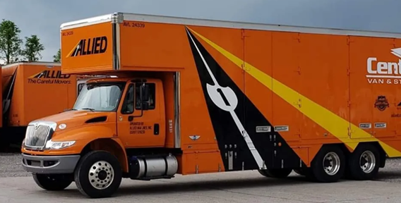 Bright orange moving truck from a professional Moving Company in Huntington WV