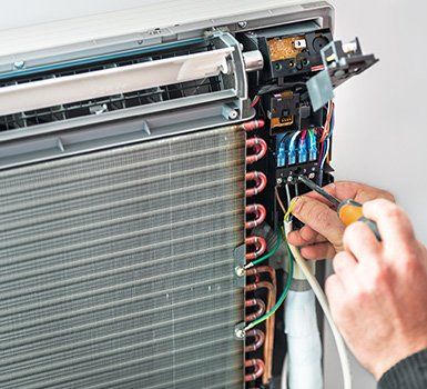 Repairing Air Conditioner — Algonquin, IL — JM Services Heating & Air Conditioning Inc.