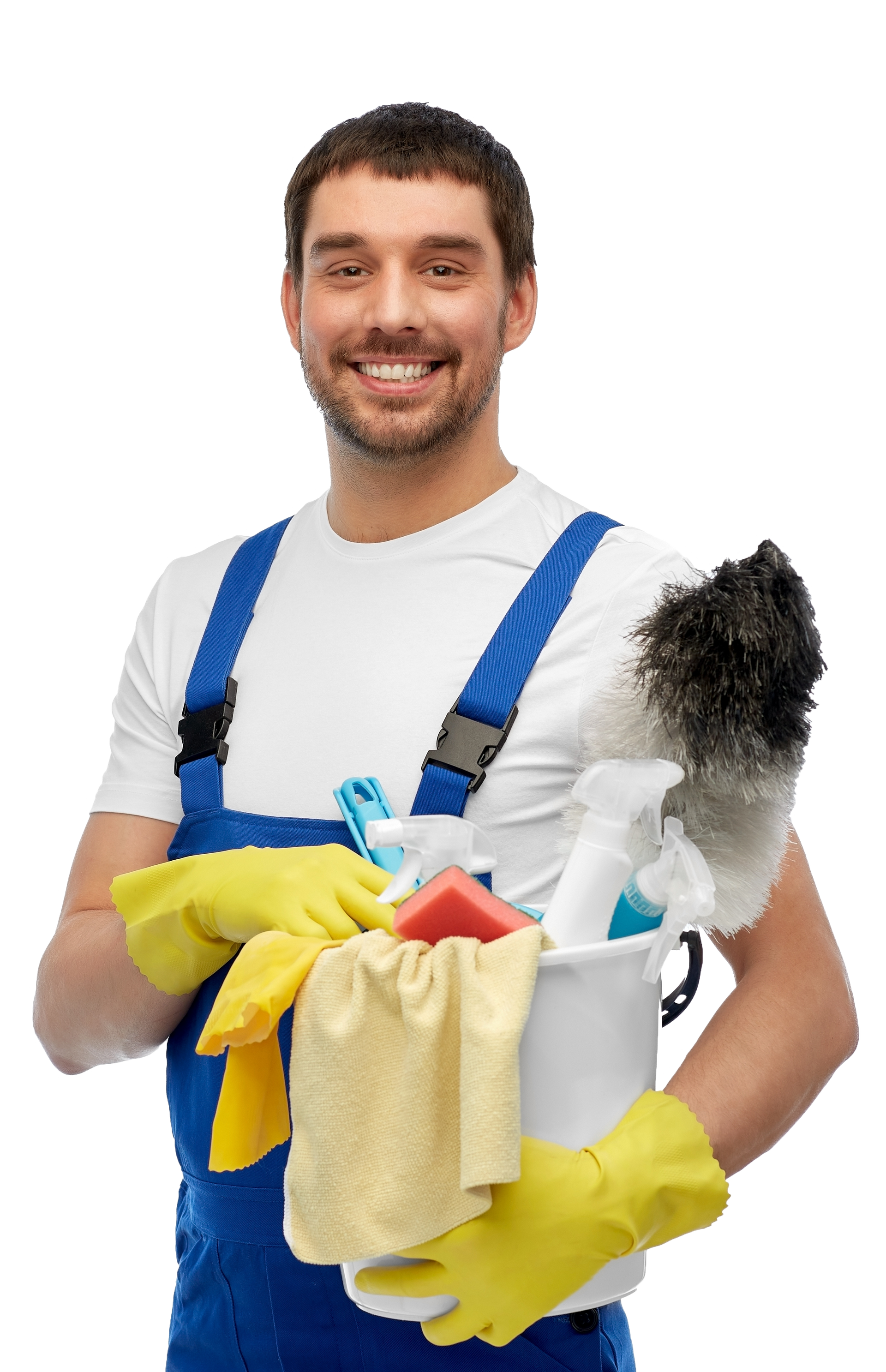 Man in blue overalls, yellow gloves, smiling, holding bucket with cleaning supplies and duster.