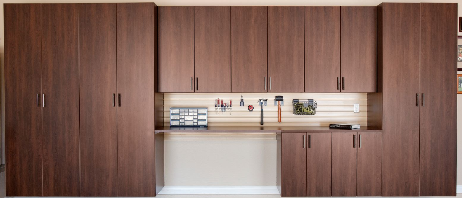 Garage storage cabinets in dark brown woodgrain finish.