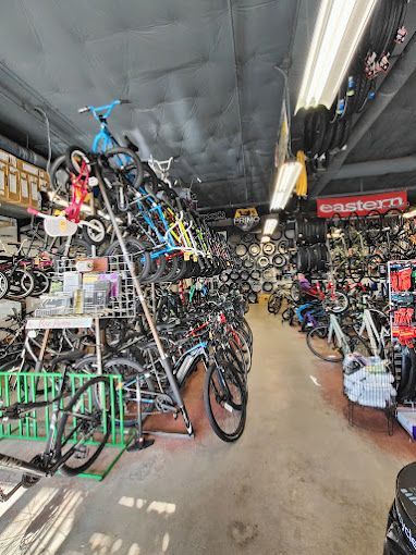 A large bicycle store filled with lots of bicycles.