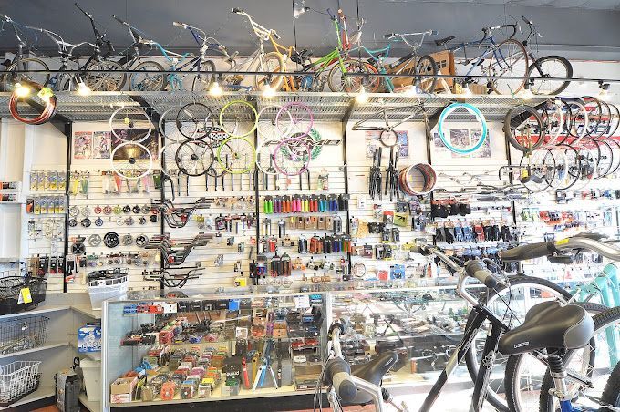 A bicycle shop filled with lots of bicycle parts and bicycles.