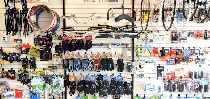 A wall filled with lots of bicycle parts and accessories.