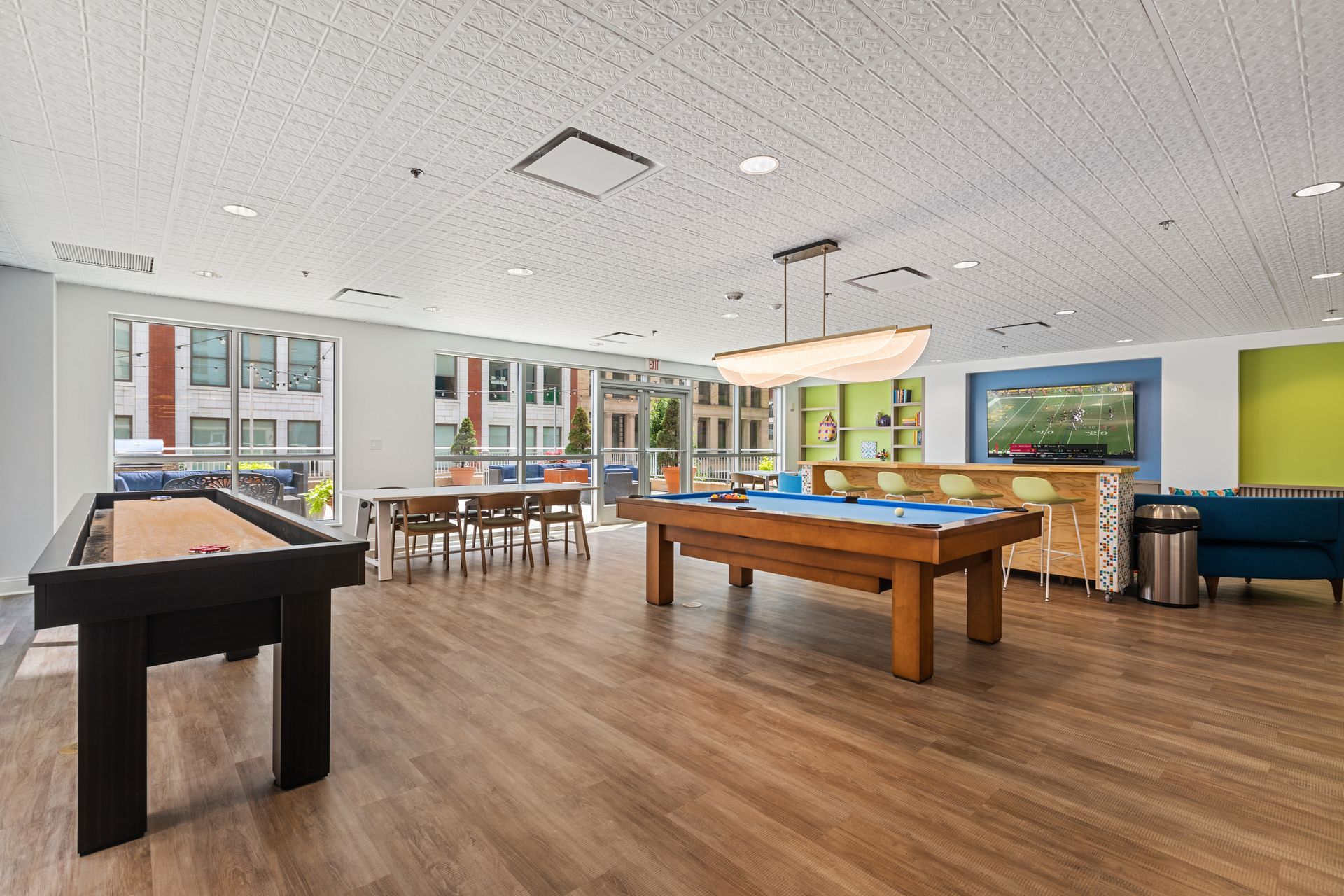There is a pool table in the middle of the room.