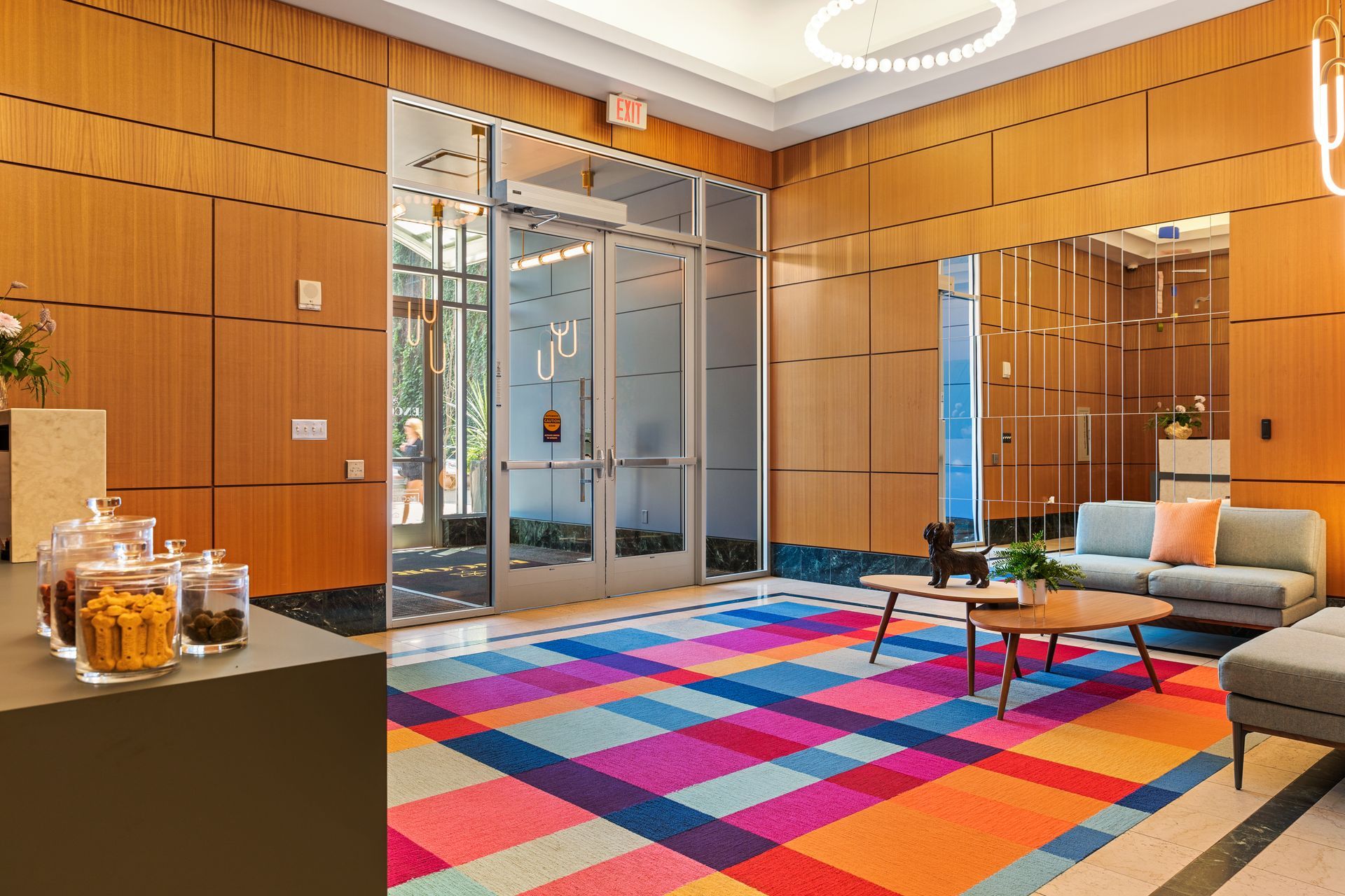 There is a colorful rug in the middle of the room.